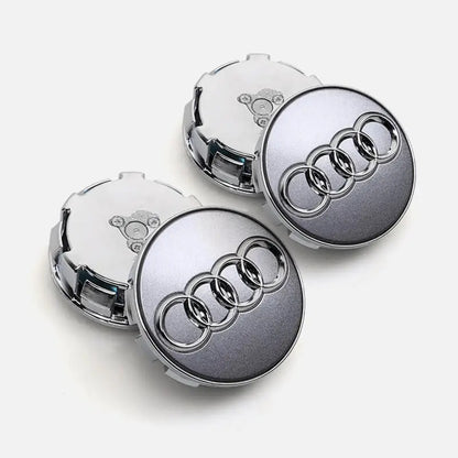 Silver grey Audi floating centre caps set on grey background