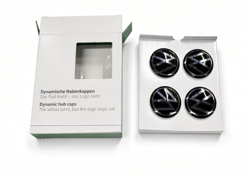 VW floating centre caps set of 4 shown with retail packaging box