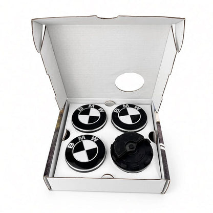 Black and white BMW floating centre caps in open white box
